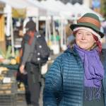 Deirdre Morrison takes in the bustling energy of the Port Townsend Farmers Market on Saturday in uptown Port Townsend. The 39-year-old is the new market manager for the Jefferson County Farmers Markets. (Nicholas Johnson/Peninsula Daily News)
