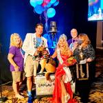 The Dream Catcher Balloon Program team celebrates Captain-Crystal Stout, third from left, winning the Ms. Senior United States title on Oct. 8 in Las Vegas. Included in the picture are, from left, Teresa Stout of Sequim), Brian St. Ours of Sequim, Lucee Light the therapy dog, Crystal Stout, Bob Holt of Sequim, and Ginger Johnson of Las Vegas. (Photo courtesy of Captain-Crystal Stout)