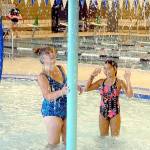 Keith Thorpe/Peninsula Daily NewsVictoria Bower of Port Angeles and her granddaughter, Ella Bower, 8, marvel at a water feature in the recreation pool at the Shore Aquatic Center in Port Angeles on Saturday's opening day. The $20 million facility replaces the former William Shore Memorial Pool with a larger building, four pools and expanded support facilities. Because of separation rules for COVID-19, swimmers are required to reserve time to prevent crowding. Blocks of swimming are currently available from 10 a.m. to noon, 1 p.m. to 3 p.m. and 4 p.m. to 6 p.m.