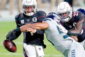 Arizona Cardinals quarterback Kyler Murray avoids the sack as Seattle Seahawks middle linebacker Bobby Wagner, right, makes the hit during the first half of an NFL football game, Sunday, Oct. 25, 2020, in Glendale, Ariz. (AP Photo/Ross D. Franklin)