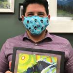 Tyler Johnson displays his United Way of Clallam County "Live United" award that features the artwork of  Todd Fischer.The 2019 campaign chair, Johnson went above and beyond to help United Way reach the campaign goal, the organization said. Submitted photo