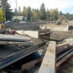 Crews work to replace the north portion of a set of culverts under U.S. Highway 101 at Bagley Creek east of Port Angeles. (Keith Thorpe/Peninsula Daily News)