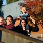 Parents Joelle and Ryan Wheatley pose with their children Anna, 9 months, and Jacob, 2, for a photo Wednesday, Oct. 21, 2020, in Seattle. As with other families, they are dealing with stricter daycare rules on possible coronavirus symptoms that feel incompatible with the germy reality of modern childhood, where a toddlers sniffle or cough could bring 10 days of quarantine. (Elaine Thompson/Associated Press)