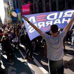 People celebrate in Times Square after former vice president and Democratic presidential candidate Joe Biden was announced as the winner over Pres. Donald Trump to become the 46th president of the United States on Saturday, Nov. 7, 2020, in New York. His victory came after more than three days of uncertainty as election officials sorted through a surge of mail-in votes that delayed the processing of some ballots. (Seth Wenig/Associated Press)