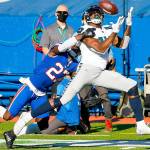 Seattle Seahawks' DK Metcalf (14) catches a pass in front of Buffalo Bills' Tre'Davious White (27) during the first half of an NFL football game Sunday, Nov. 8, 2020, in Orchard Park, N.Y. (AP Photo/Jeffrey T. Barnes)