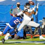 Seattle Seahawks DK Metcalf (14) catches a pass in front of Buffalo Bills TreDavious White (27) during the first half of an NFL football game Sunday, Nov. 8, 2020, in Orchard Park, N.Y. (AP Photo/Jeffrey T. Barnes)