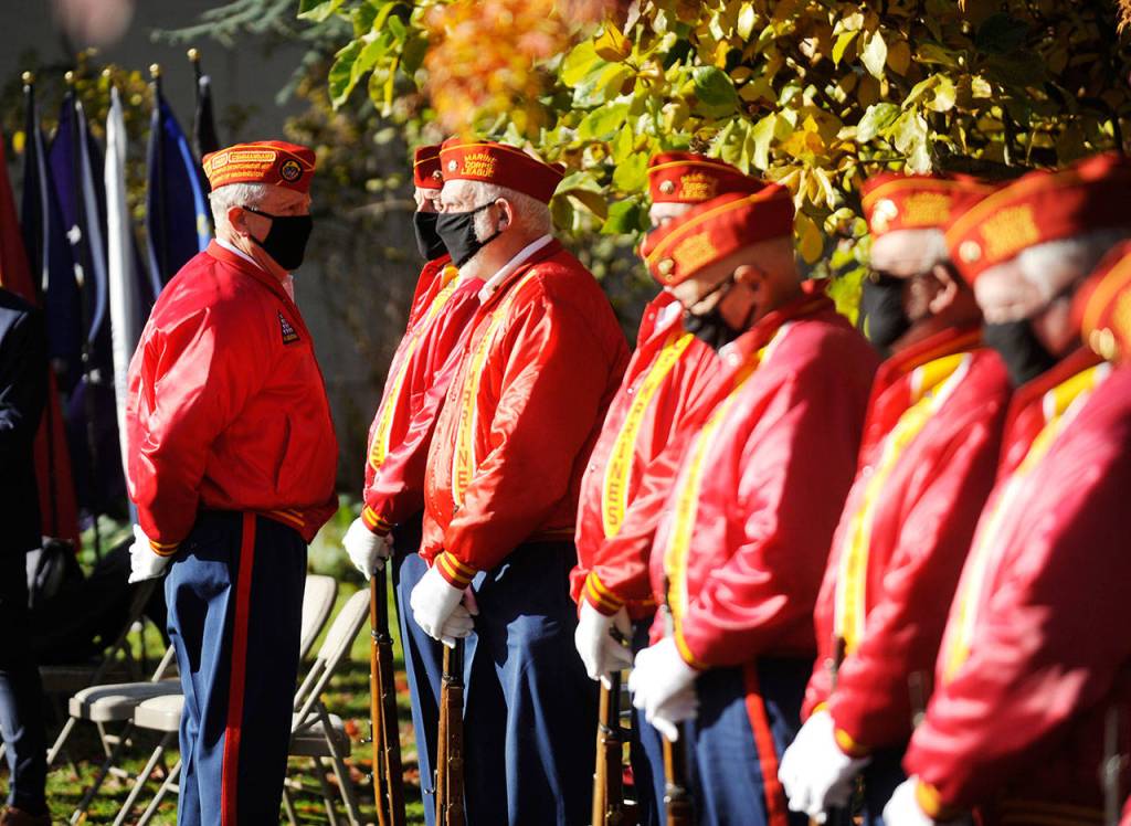 Members of the Marine Corps Leagues Mt. Olympus Detachment help celebrate veterans during a special ceremony at Sequims Pioneer Memorial Park on Wednesday. (Michael Dashiell/Olympic Peninsula News Group)