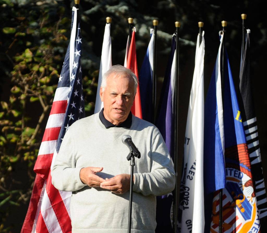 Tom Ferrell, a U.S. Air Force veteran and City of Sequim deputy mayor, addresses a crowd at a special Veterans Day ceremony at Pioneer Memorial Park on Wednesday. (Michael Dashiell/Olympic Peninsula News Group)
