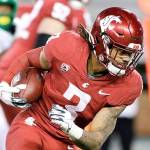 Washington State running back Deon McIntosh (3) carries the ball during the second half of an NCAA college football game against Oregon in Pullman, Wash., Saturday, Nov. 14, 2020. Oregon won 43-29. (AP Photo/Young Kwak)