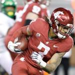 Washington State running back Deon McIntosh carries the ball during the second half against Oregon in Pullman on Saturday. Oregon won 43-29. (AP Photo/Young Kwak)