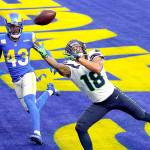 Seattle Seahawks wide receiver Freddie Swain (18) reaches but can't catch a pass in the end zone during the first half of an NFL football game against the Los Angeles Rams Sunday, Nov. 15, 2020, in Inglewood, Calif. (AP Photo/Ashley Landis)