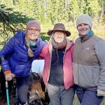 Amputee Dana Lawson, left, celebrates arriving at Deer Lake after a 4-mile trail ride on narrow, steep and rocky terrain  aboard horses and mules with friends Sherry Baysinger, center, and Lindsay Leiendecker. (Larry Baysinger)