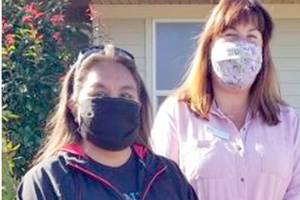 New homeowner Lana Sampson poses with                                        

Colleen Robinson from Habitat for Humanity of Clallam County.