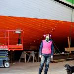 Ginny Wilson, Tim Lee and Tuff the dog are part of the Western Flyer restoration crew at the Shipwrights Cooperative in Port Townsend. (Diane Urbani de la Paz/Peninsula Daily News)