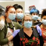 Working on Thanksgiving in the Tri-Area Community Center kitchen are Anita Schmucker, center, and her foster kids, from left, Mya, Rosemary, Friday and Sadie. The family helped prepare some 300 dinners at the Chimacum center Thursday. (Diane Urbani de la Paz/Peninsula Daily News)