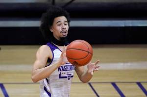 Washington's Nate Pryor passes during an NCAA college basketball practice Tuesday, Oct. 27, 2020, in Seattle. Pryor is among several transfers to Washington who the Huskies are hopeful can all make an immediate impact. (AP Photo/Elaine Thompson)