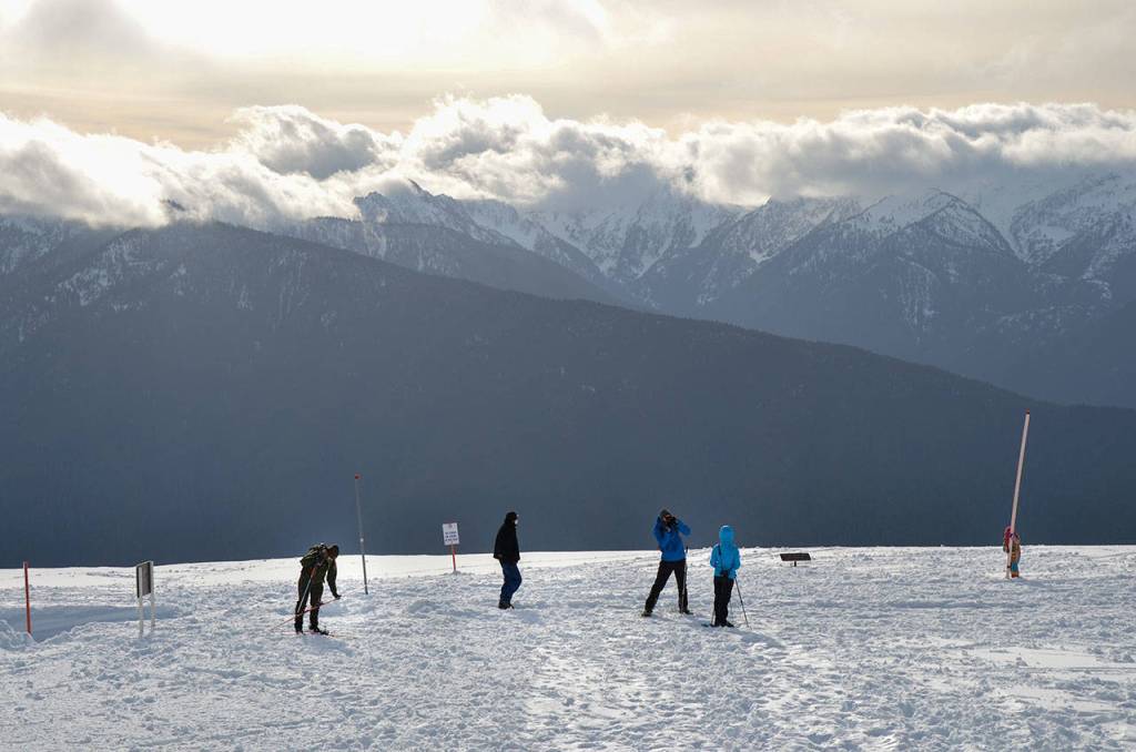 People enjoy various winter activities up at Hurricane Ridge on Friday, Nov. 27, 2020. (Laura Foster/Peninsula Daily News)