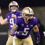 Washington quarterback Dylan Morris, left, drops to pass as running back Sean McGrew (5) takes off from the line of scrimmage during the second half of an NCAA college football game against Utah, Saturday, Nov. 28, 2020, in Seattle. (AP Photo/Ted S. Warren)