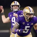 Washington quarterback Dylan Morris, left, drops to pass as running back Sean McGrew (5) takes off from the line of scrimmage during the second half of an NCAA college football game against Utah, Saturday, Nov. 28, 2020, in Seattle. (AP Photo/Ted S. Warren)