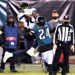Seattle Seahawks' DK Metcalf (14) catches a pass against Philadelphia Eagles' Darius Slay (24) during the second half of an NFL football game, Monday, Nov. 30, 2020, in Philadelphia. (AP Photo/Derik Hamilton)