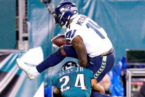 Seattle Seahawks' DK Metcalf (14) tries to get past Philadelphia Eagles' Darius Slay (24) during the first half of an NFL football game, Monday, Nov. 30, 2020, in Philadelphia. (AP Photo/Chris Szagola)