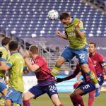 Seattle Sounders defender Shane ONeill (27) heads in a goal against FC Dallas during the second half of an MLS playoff soccer match, Tuesday in Seattle. (AP Photo/Ted S. Warren)