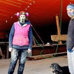 The Western Flyer, made famous in John Steinbeck's "The Log from the Sea of Cortez," is being restored at the Shipwrights Cooperative in Port Townsend with Ginny Wilson, Tim Lee and Tuff the dog on the crew. A tour of the project is one of the items in the Jefferson County Historical Society's AHA Auction wrapping up this weekend. (Diane Urbani de la Paz/Peninsula Daily News)