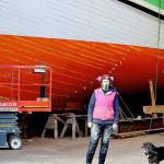 The Western Flyer, made famous in John Steinbecks The Log from the Sea of Cortez, is being restored at the Shipwrights Cooperative in Port Townsend with Ginny Wilson, Tim Lee and Tuff the dog on the crew. A tour of the project is one of the items in the Jefferson County Historical Societys AHA Auction wrapping up this weekend. (Diane Urbani de la Paz/Peninsula Daily News)