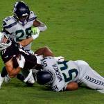 Arizona Cardinals wide receiver Andy Isabella (17) is hit by Seattle Seahawks middle linebacker Bobby Wagner (54) during the second half of an NFL football game, Sunday, Oct. 25, 2020, in Glendale, Ariz. (AP Photo/Ross D. Franklin)