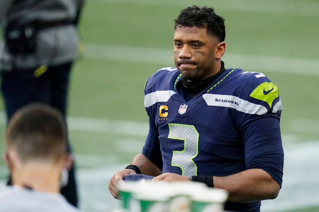 Seattle Seahawks quarterback Russell Wilson reacts on the sideline during the second half of an NFL football game against the New York Giants, Sunday, Dec. 6, 2020, in Seattle. (AP Photo/Elaine Thompson)