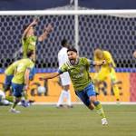 Seattle Sounders' Cristian Roldan (7) celebrates a Sounders goal late in the second half of an MLS playoff Western Conference final soccer match against Minnesota United, Monday, Dec. 7, 2020, in Seattle. The Sounders won 3-2. (AP Photo/Ted S. Warren)