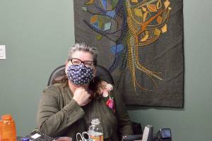 Siobhan Canty, CEO of the Jefferson Community Foundation, works with the Housing Solutions Network in her new office space in Port Townsend. After the foundation was evicted from its Port Hadlock office, Edensaw Woods donated the Julian Street space. (Diane Urbani de la Paz/Peninsula Daily News)