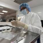 A pharmacist labels syringes in a clean room where doses of COVID-19 vaccines will be handled Wednesday, Dec. 9, 2020, at Mount Sinai Queens hospital in New York. The hospital expects to receive doses once a vaccine gets the emergency green light by U.S. regulators (Mark Lennihan/Associated Press)