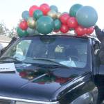 Dave Logan/for Peninsula Daily News
Chelsey Bettger of Joyful Events and Balloons, left, and Katheryn Murray of PNW Mobile Detailing decorate one of the vehicles to be in the Candy Cane Parade of Happiness.