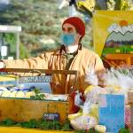 Bruce Gleeman of Chimacum Valley Dairy offers holiday cheese-and-soap baskets at the Port Townsend Farmers Market, which wraps its season this Saturday. (Diane Urbani de la Paz/Peninsula Daily News)