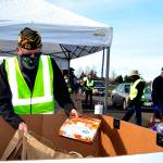 Volunteers like Calvin Barnard, senior vice commander of Carlsborg VFW Post 6787, helped    distribute food at the Family Holiday Meal Bay program on Nov. 20. Dozens of volunteers return on Dec. 18 to help provide food for Christmas. Sequim Gazette photo by Matthew Nash