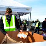 Volunteers like Calvin Barnard, senior vice commander of Carlsborg VFW Post 6787, helped distribute food at the Family Holiday Meal Bay program Nov. 20, 2020. Dozens of volunteers return Dec. 18 to help provide food for Christmas. (Matthew Nash/Olympic Peninsula News Group)