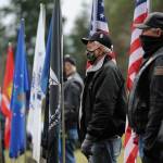Members of the Clallam County Legion Riders Post 29 create a flag line as a patriotic backdrop to the Wreaths Across America event held Dec. 19 at Sequim View Cemetery. (Michael Dashiell/Olympic Peninsula News Group)