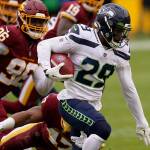 Seattle Seahawks free safety D.J. Reed (29) runs with the ball during the first half of an NFL football game against the Washington Football Team, Sunday, Dec. 20, 2020, in Landover, Md. (AP Photo/Andrew Harnik)