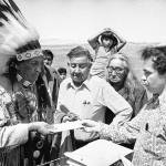 In this May 5, 1973 file photo Hank Adams, right, permanent representative of the Indians Trial of Broken Treaties presents letter from the White House to traditional Sioux Chief Frank Fools Crow, left, at border of Pine Ridge Reservation in Scenic,. S.D. (AP Photo)