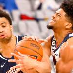Virginia guard Jabri Abdur-Rahim (1) and Gonzaga guard Aaron Cook (4) wrestle for control of the ball during the second half of an NCAA college basketball game Saturday, Dec. 26, 2020, in Fort Worth, Texas. Gonzaga won 98-75. (AP Photo/Ron Jenkins)