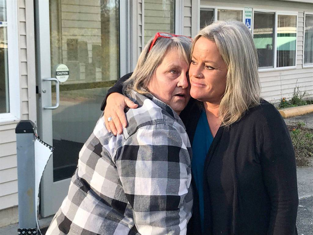 Becky Ruby, left, and Tanya Gardner say goodbye after a remembrance service soon after Valerie Claplanhoos death. (Paul Gottlieb/Peninsula Daily News file)
