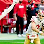 San Francisco 49ers quarterback C.J. Beathard (3) looks to pass as Arizona Cardinals defensive end Zach Allen (94) defends during the first half of an NFL football game, Saturday, Dec. 26, 2020, in Glendale, Ariz. (AP Photo/Rick Scuteri)