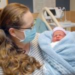 Kaitlyn Loghry of Forks looks at her son, Ethan Scott Loghry, at Olympic Medical Center. The baby is named for his father, Scott Loghry, and grandfather. (Keith Thorpe/Peninsula Daily News)
