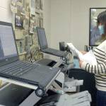 Keith Thorpe/Peninsula Daily News
Clallam County Elections Supervisor Susan Johnson leafs through a stack of test ballots during a logic and accuracy test of the county's two ballot scanners on Wednesday at the Clallam County Courthouse in Port Angeles. The test, performed before every election, showed that the scanners came up with the expected results and passed certification.