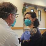 <strong>Michael Dashiell</strong>/Olympic Peninsula News Group
Robin Worth-McIntyre, a nurse technician at Avamere Olympic Rehabilitation of Sequim, gets a Pfizer COVID-19 vaccine shot from Walgreens pharmacist Steve Sommers.