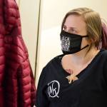 Terra Hampton, a member of the Nadines Kitchen crew, works with Grace Love, cooking hundreds of meals for the YMCA-Community Wellness Project program for local families. (Diane Urbani de la Paz/Peninsula Daily News)