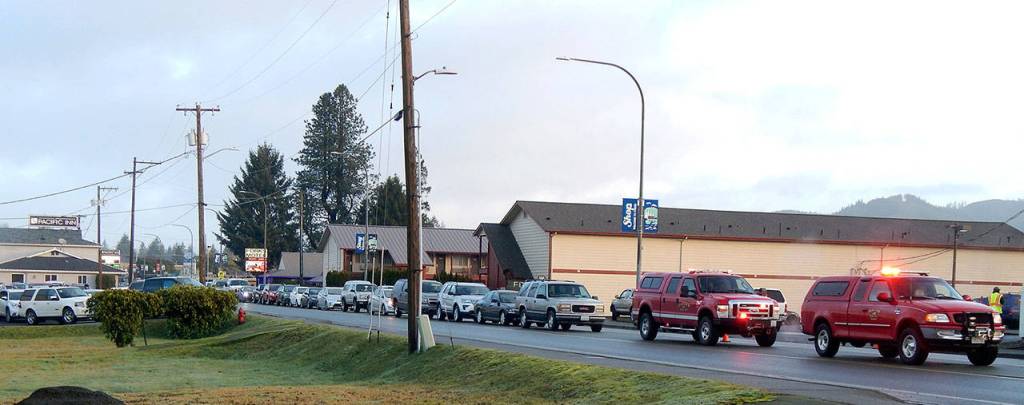 Cars line up in Forks during a vaccination clinic.