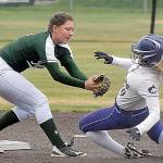 Sequim’s Greta Christianson, center, attempts to reach second as Port Angeles’ Jada Cargo waits to make the tag while umpire Scott Ramsey looks on in a May 2019 playoff game at Billy Whiteshoes Memorial Park west of Port Angeles. (Keith Thorpe /Peninsula Daily News)