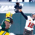 Tampa Bay Buccaneers quarterback Tom Brady (12) passes against the Green Bay Packers during the first half of the NFC championship NFL football game in Green Bay, Wis., Sunday, Jan. 24, 2021. (AP Photo/Mike Roemer)